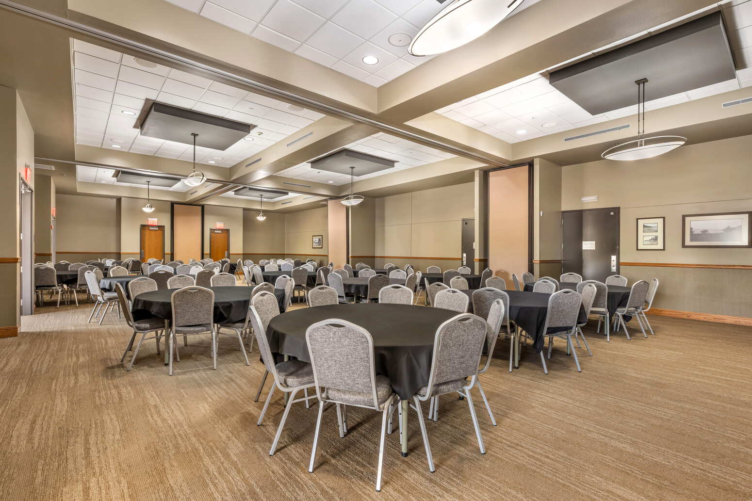 Banquet room set with round tables and chairs